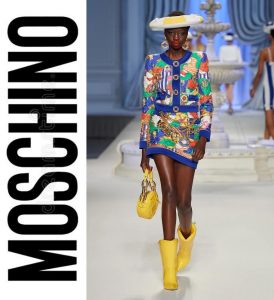 Anyiang modeling a colorful fashion outfit on the runway for Moschino