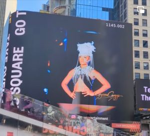 Briana as she appears modeling on the runway on the Times Square billboard