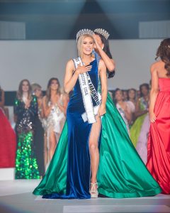 Hailey being crowned with her title on stage as Miss Mississippi