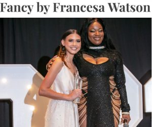 Francesca receiving the award at the Deck the Runway holiday fashion show