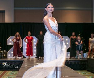 Francesca walking in the Deck the Runway holiday fashion show