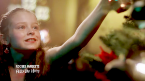 screengrab of Layla decorating a Christmas tree in the Rouses Market commercial