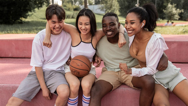 group of teens smiling and laughing