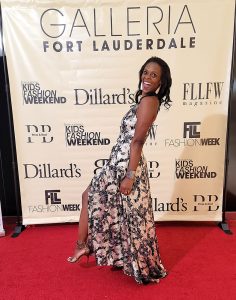 Dr. Simone on the red carpet at a fashion event