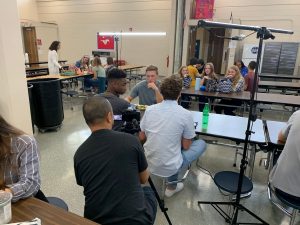 Roy on set of Filtered filming teen actors in a lunchroom setting